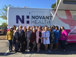 Women's Council standing in front of mobile mammogram vehicle